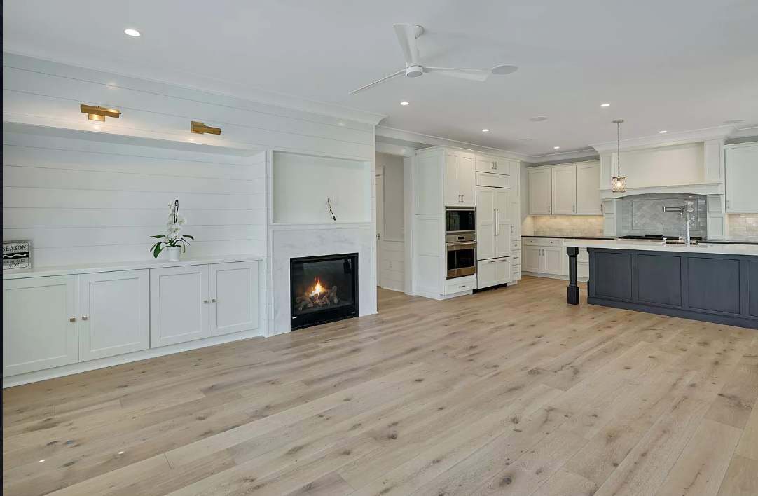 There is a fireplace in the middle of the living room.