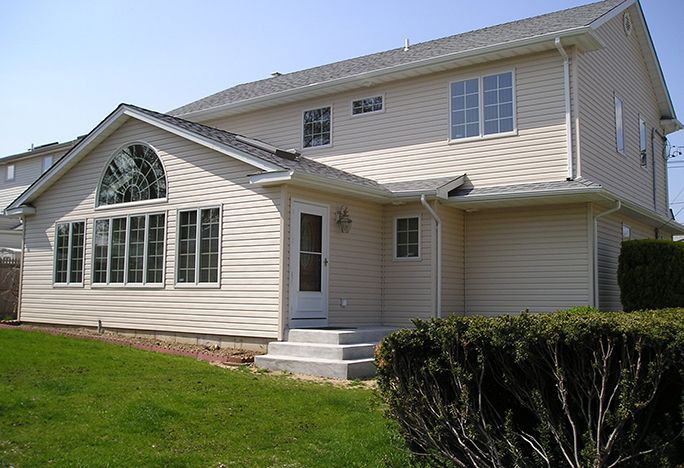 A large white house with a lot of windows
