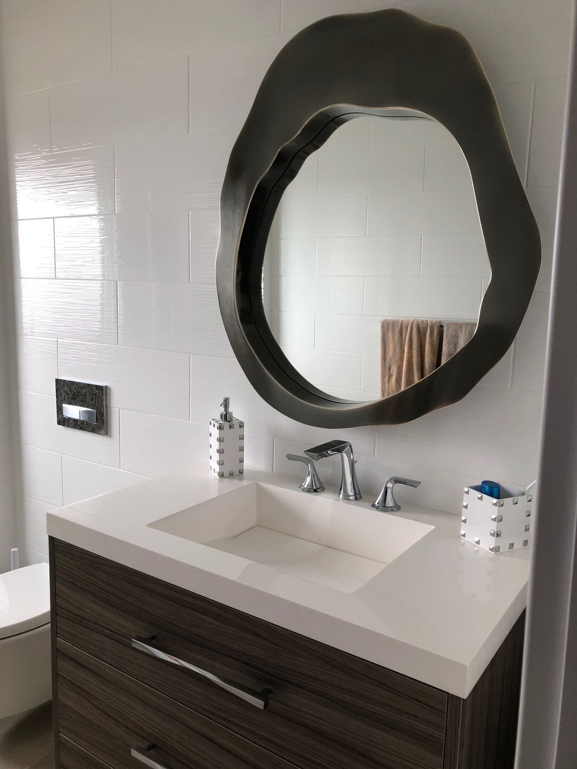 A bathroom sink with a large mirror above it