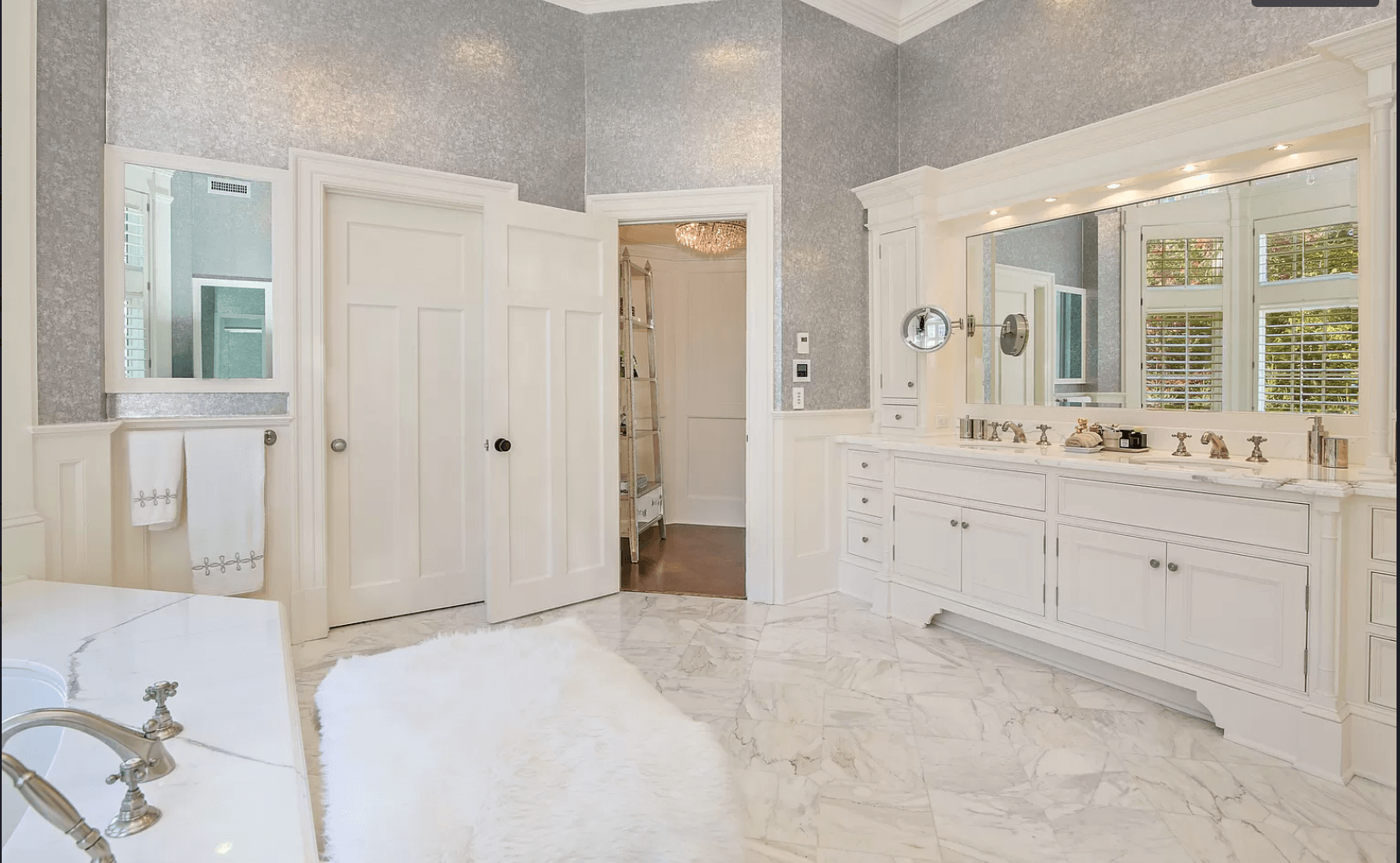 A bathroom with two sinks and two mirrors