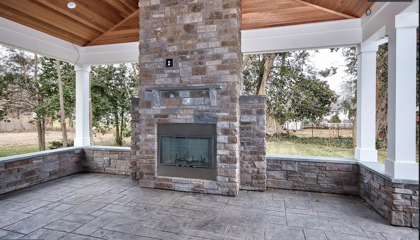 There is a fireplace in the middle of the room.