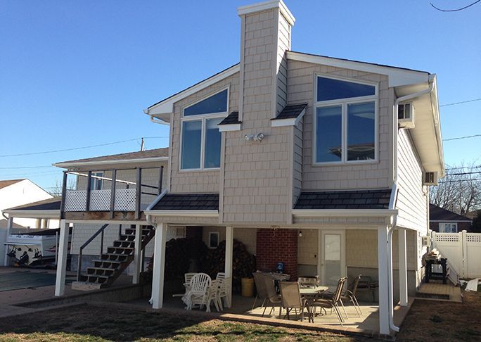 The back of a house with a deck and stairs