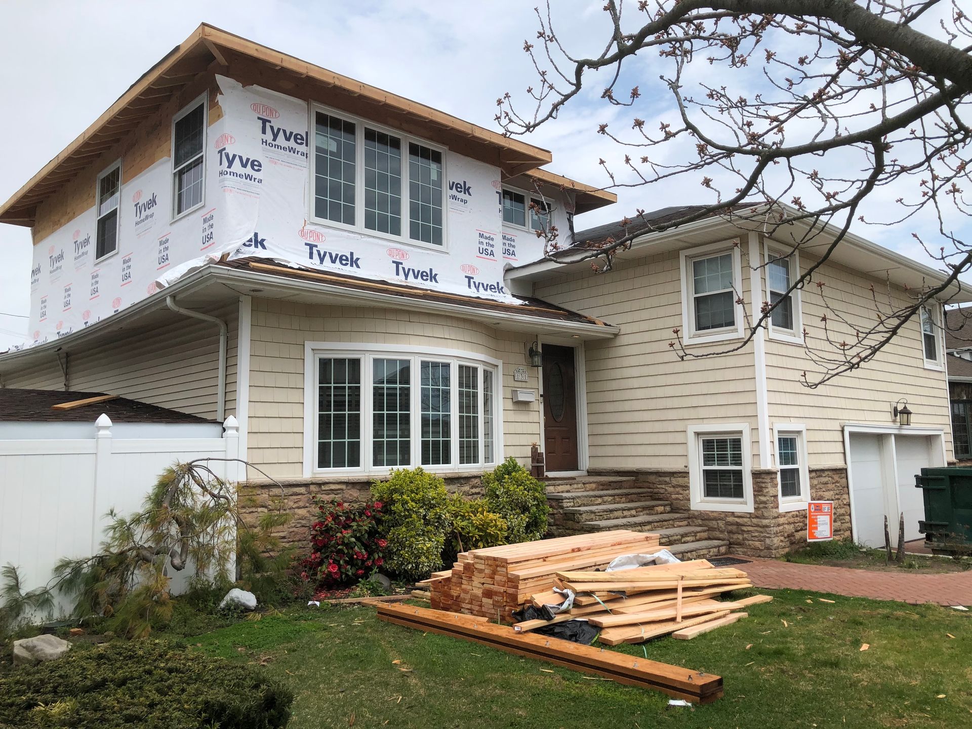 A house with a lot of windows is being remodeled.