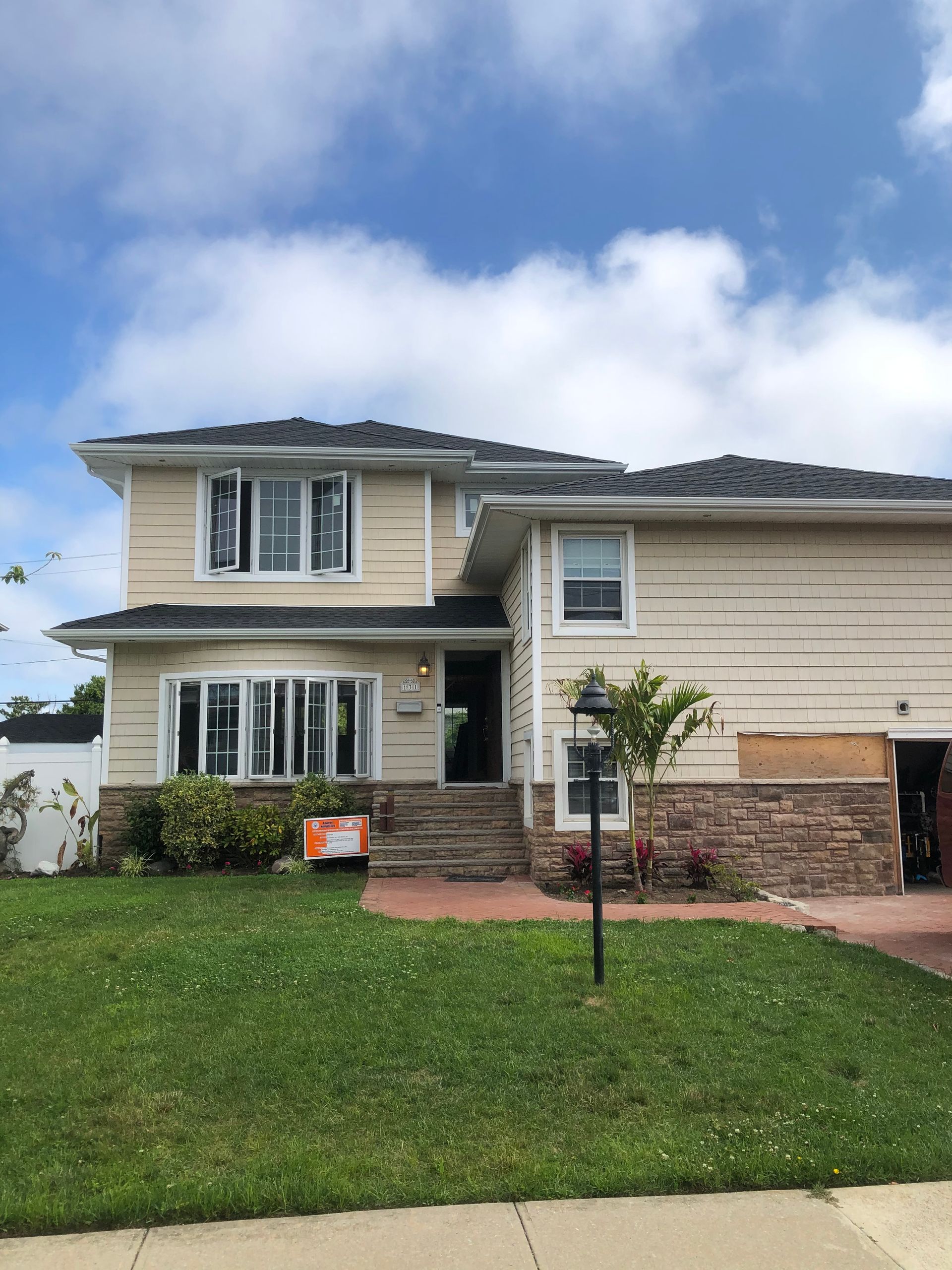 A house with a lot of windows is for sale