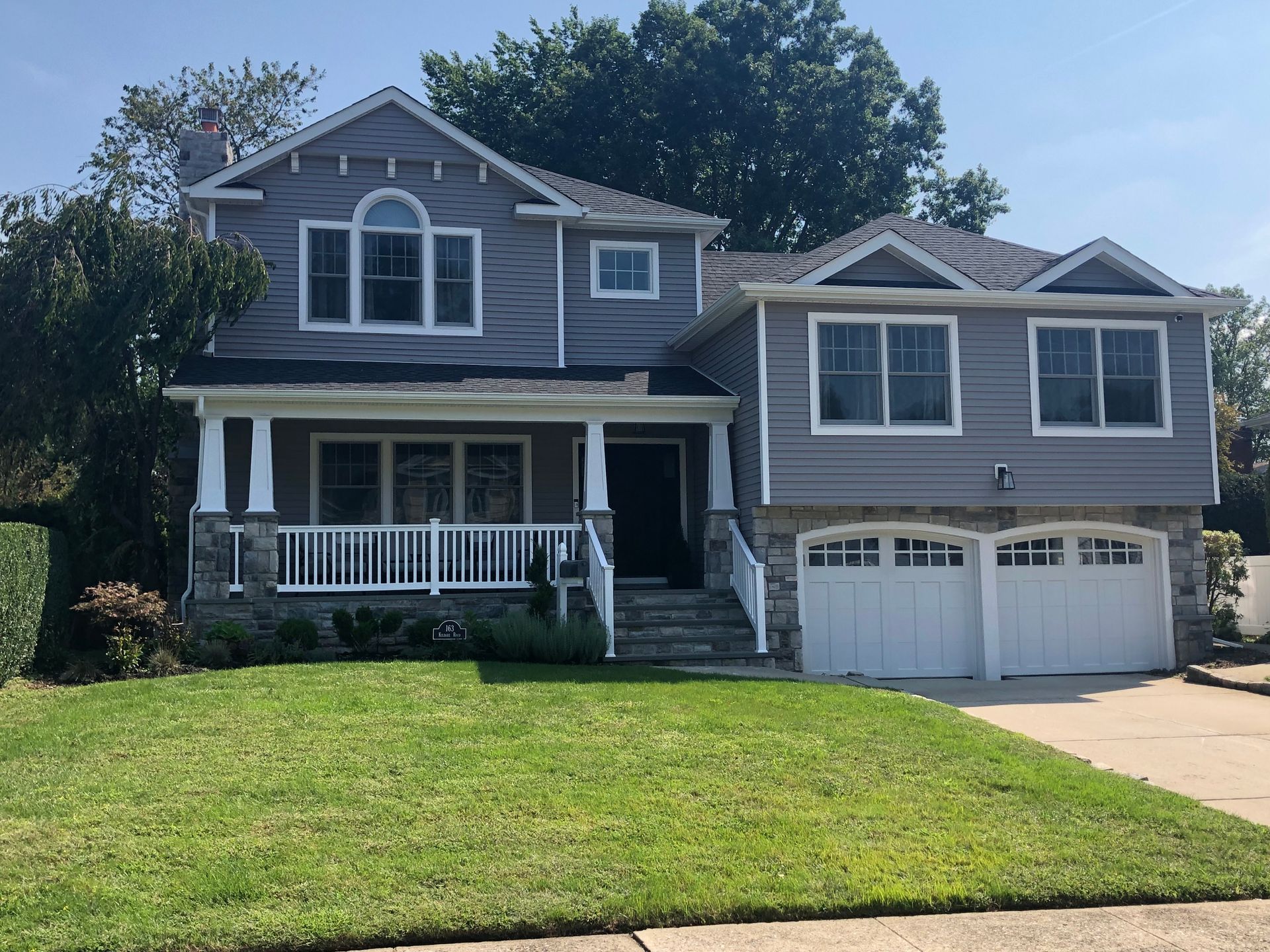 A large house with a large lawn in front of it