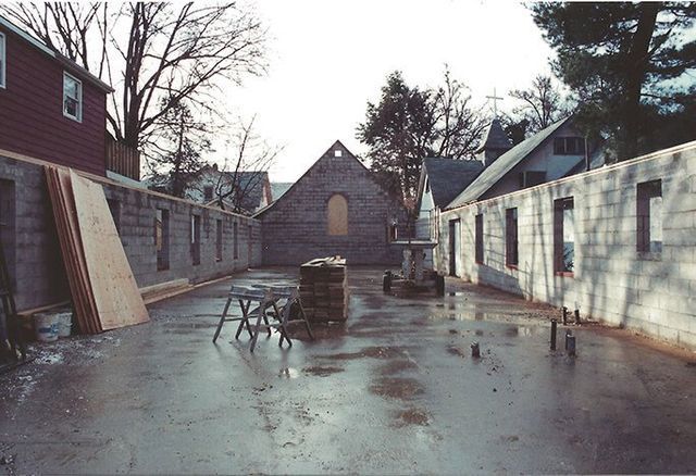 A brick wall with the letter t on it