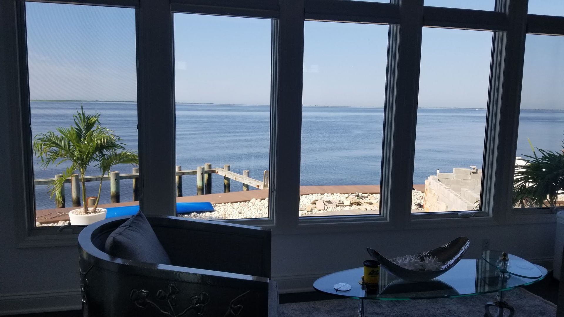 A living room with a view of the ocean
