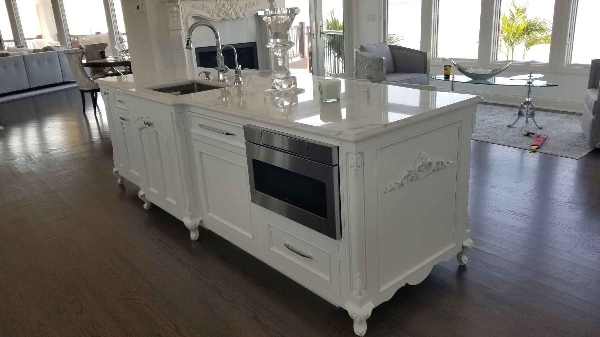 There is a large island in the middle of the kitchen.