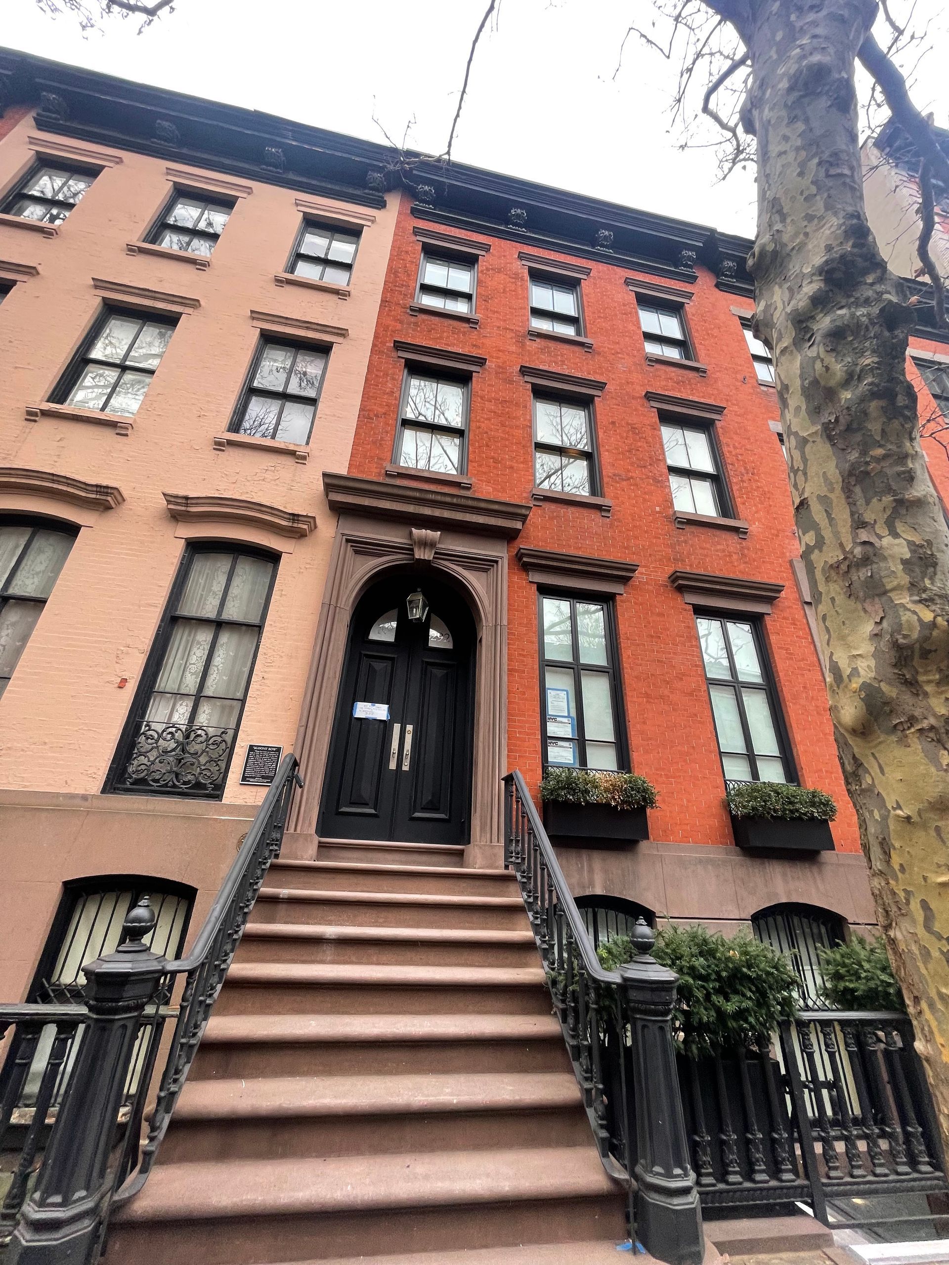 A building with stairs leading up to the front door