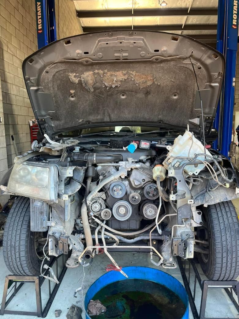 A Car With the Hood Up is Being Worked on in a Garage — BA Auto Electrical In West Mackay, QLD