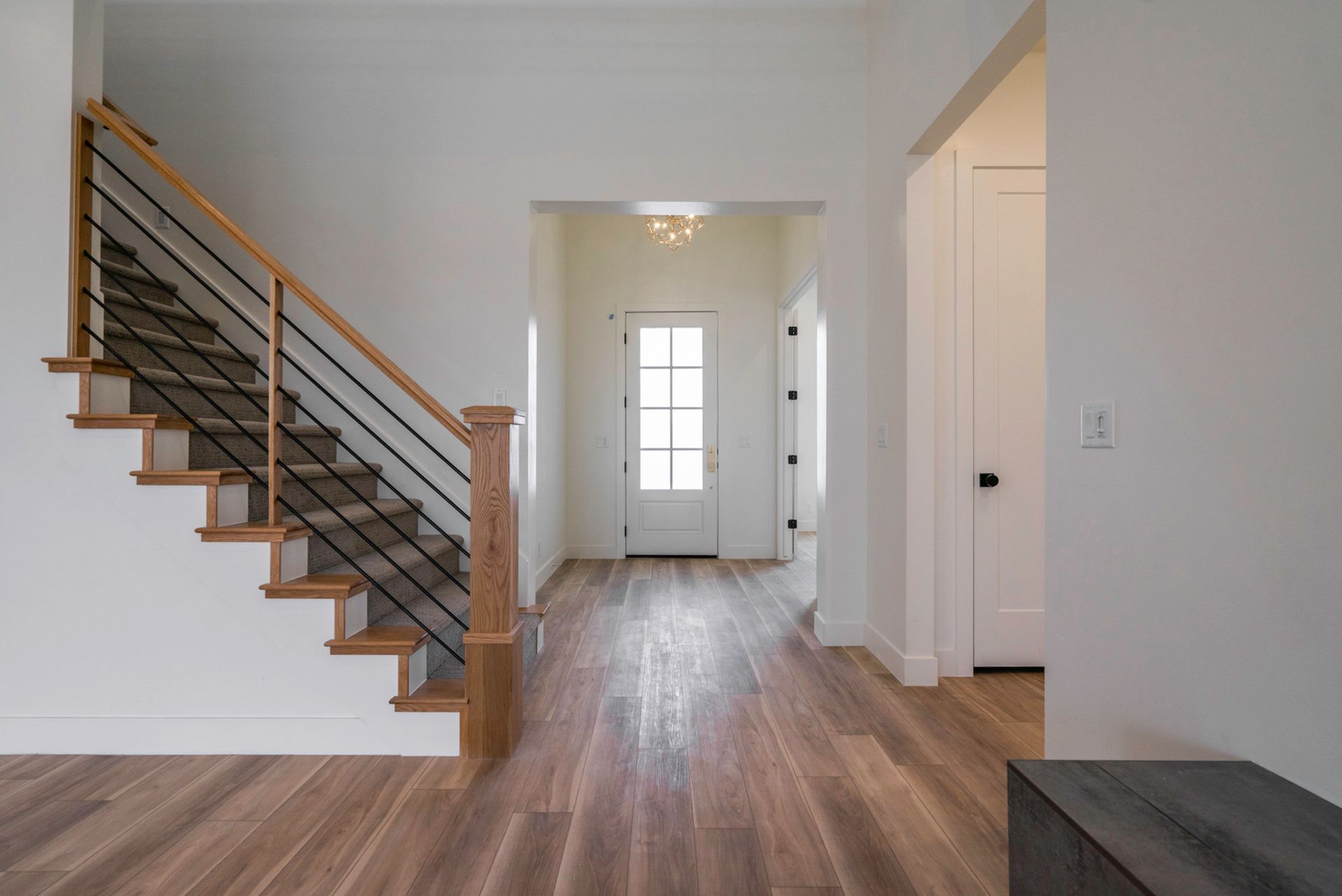 There is a staircase in the middle of the hallway.