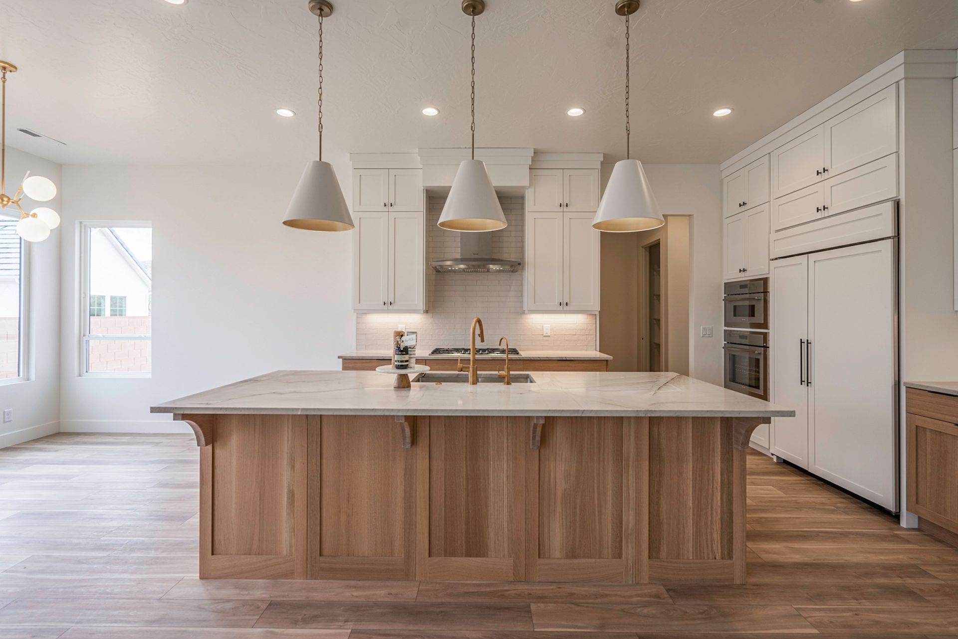 There is a large island in the middle of the kitchen.