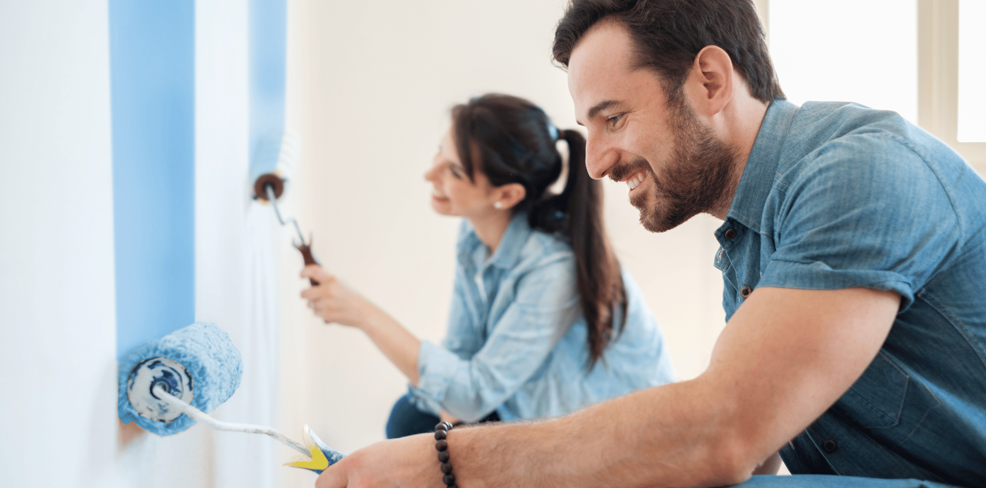 A couple doing DIY House painting