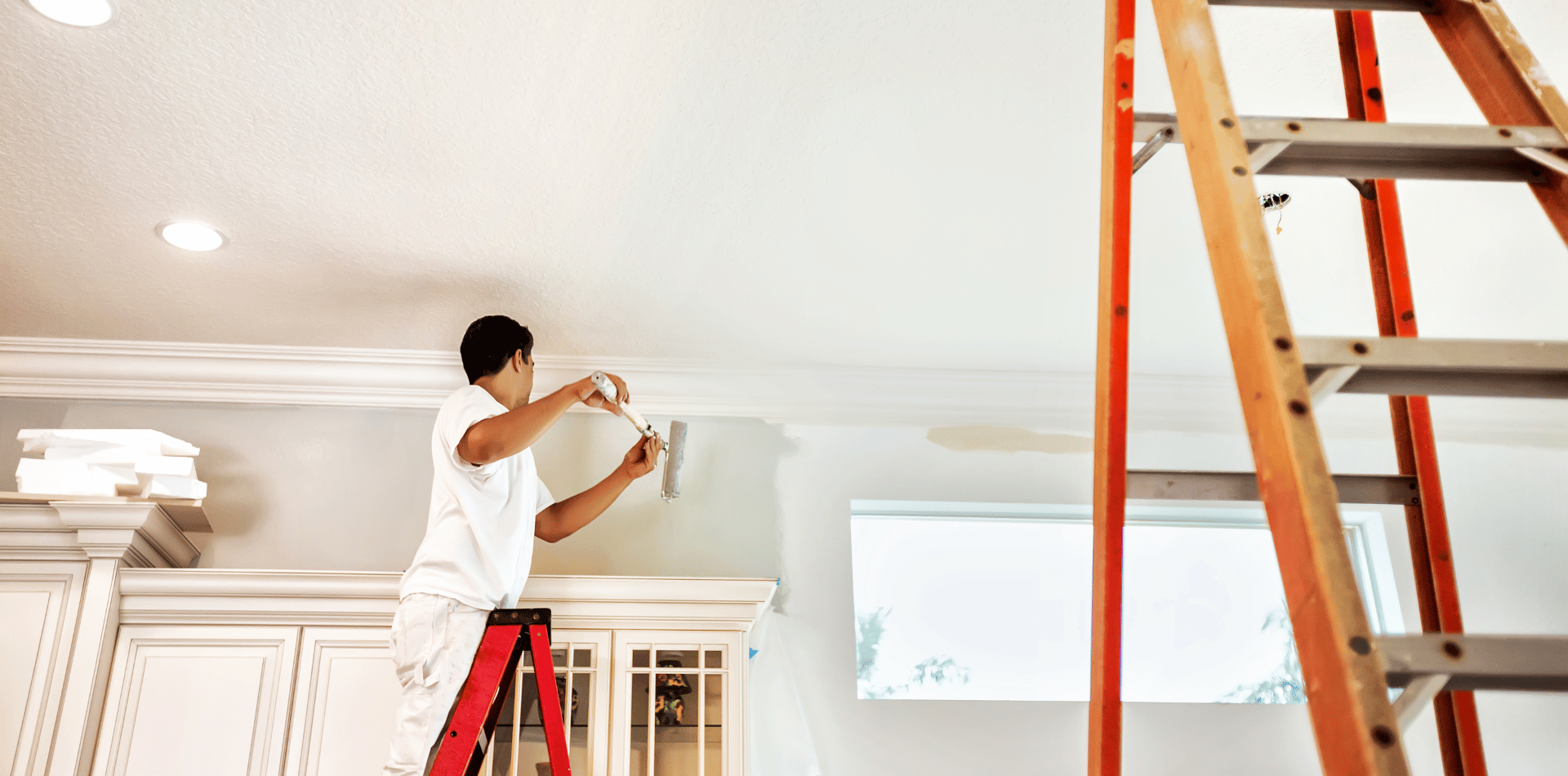 A professional Painter on a ladder