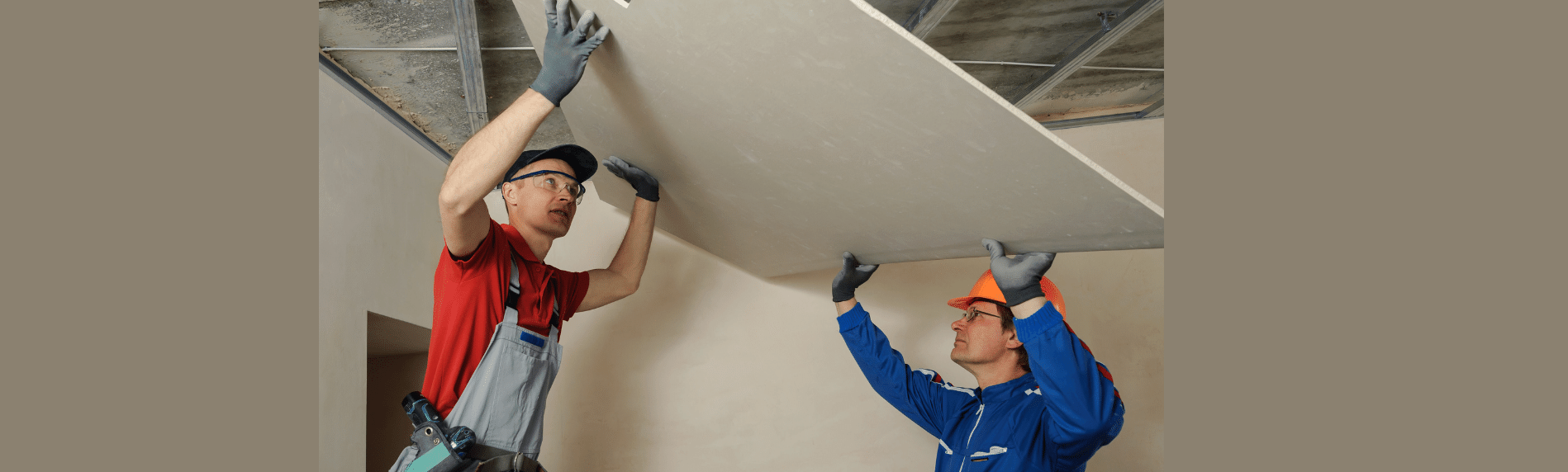 Two men plastering a wall