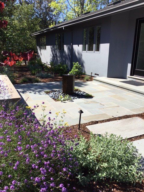 stone path and patio with landscaping