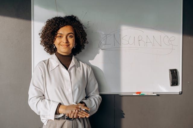  person-standing-in-front-of-a-white-board-with-the-words-insurance-on-it-circled