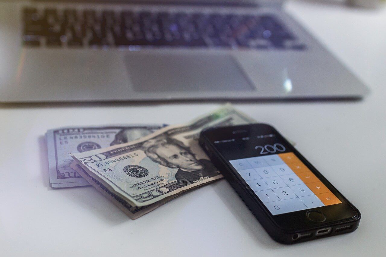 Smart Phone, Money, Laptop on Desk