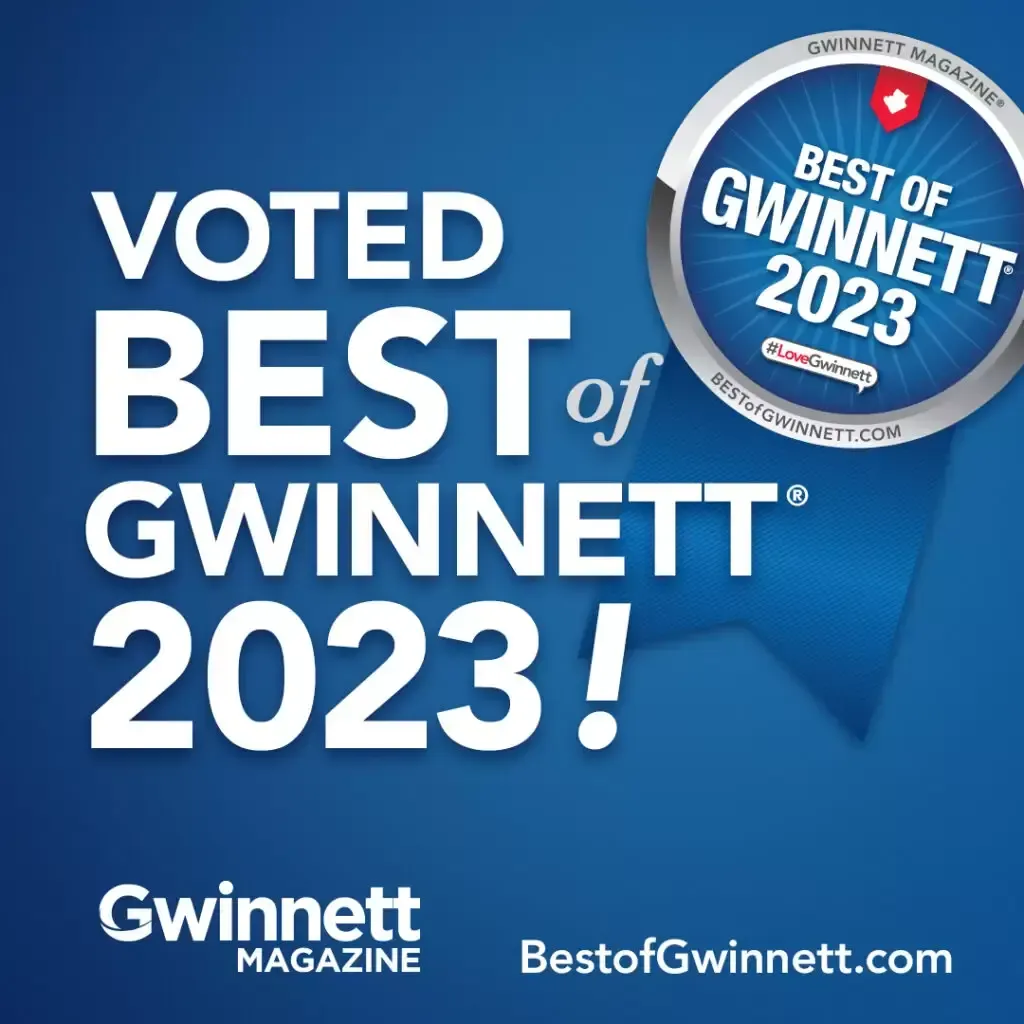 A blue sign that says `` voted best of gwinnett 2023 ! ''