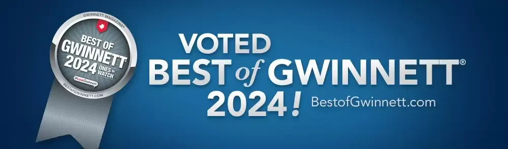 A blue sign that says voted best of gwinnett 2024