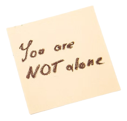 Handwritten note on a beige square paper reading “You are NOT alone.”