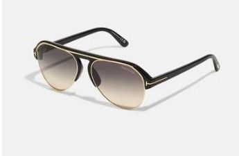 Un paio di occhiali da sole aviator tom ford su sfondo bianco.