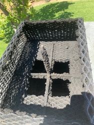 A close up of a chimney with holes in it.