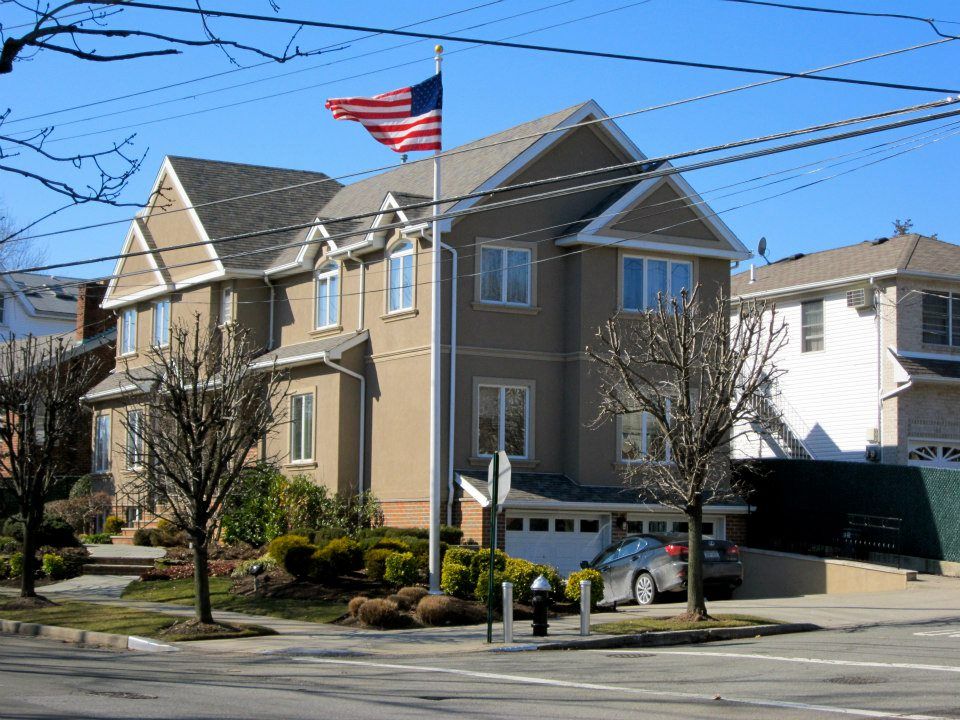 Brown Painted House with US Flag - Architects in Staten Island, NY