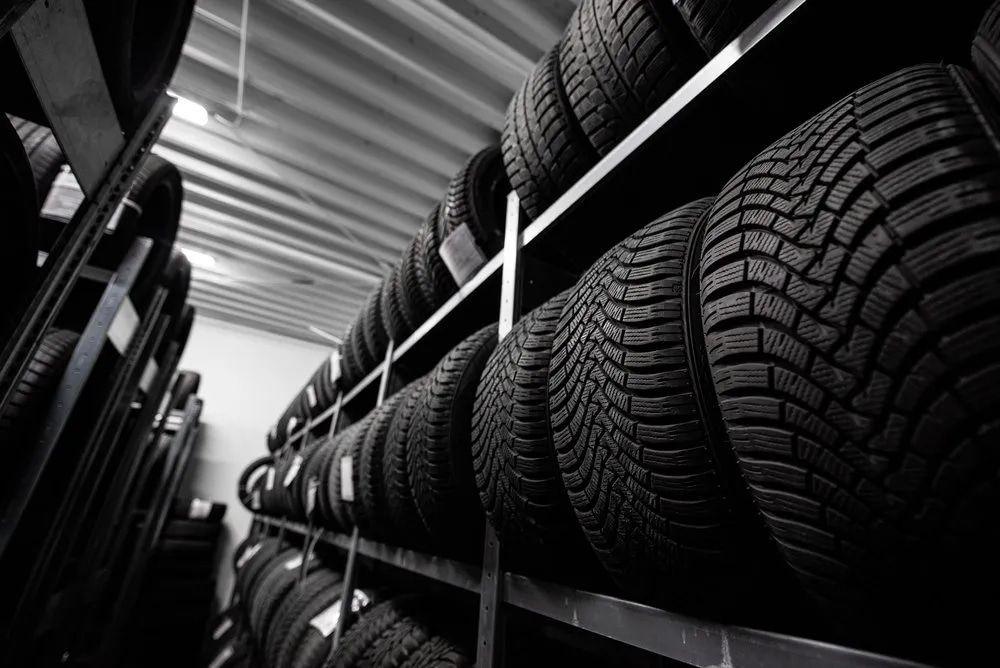 Tires Stacked on Shelves in a Storage Room, Seen From a Low Angle — Wheel Alignment Centre in Braitling, NT