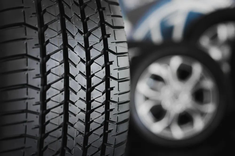 Close-up of a New Tire With Textured Tread, Blurred Background of a Car Wheel — Wheel Alignment Centre in Braitling, NT