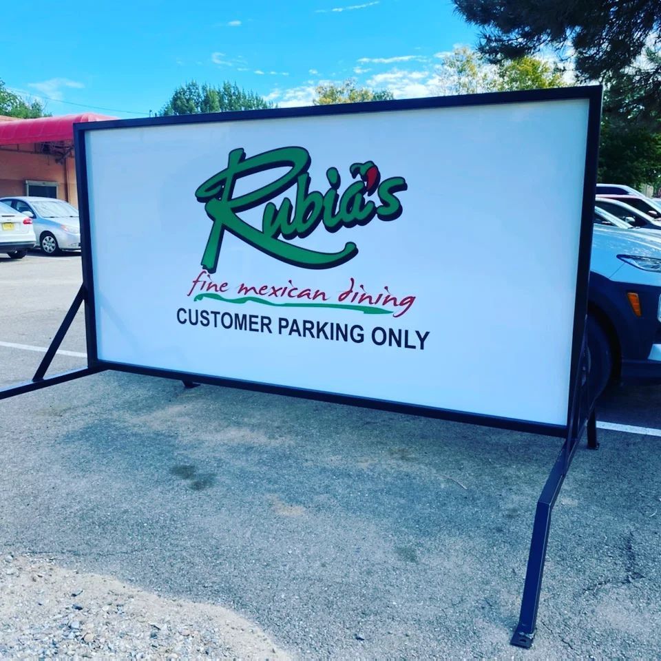 A sign for rubies fine mexican dining customer parking only