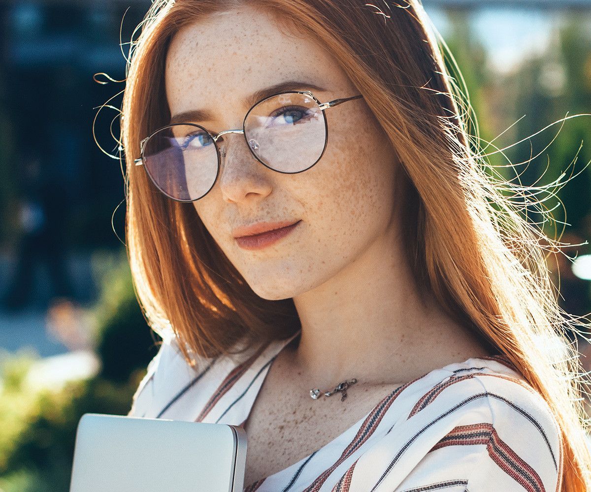 A women wearing a big  black glasses— Optometrist in Wallsend, NSW