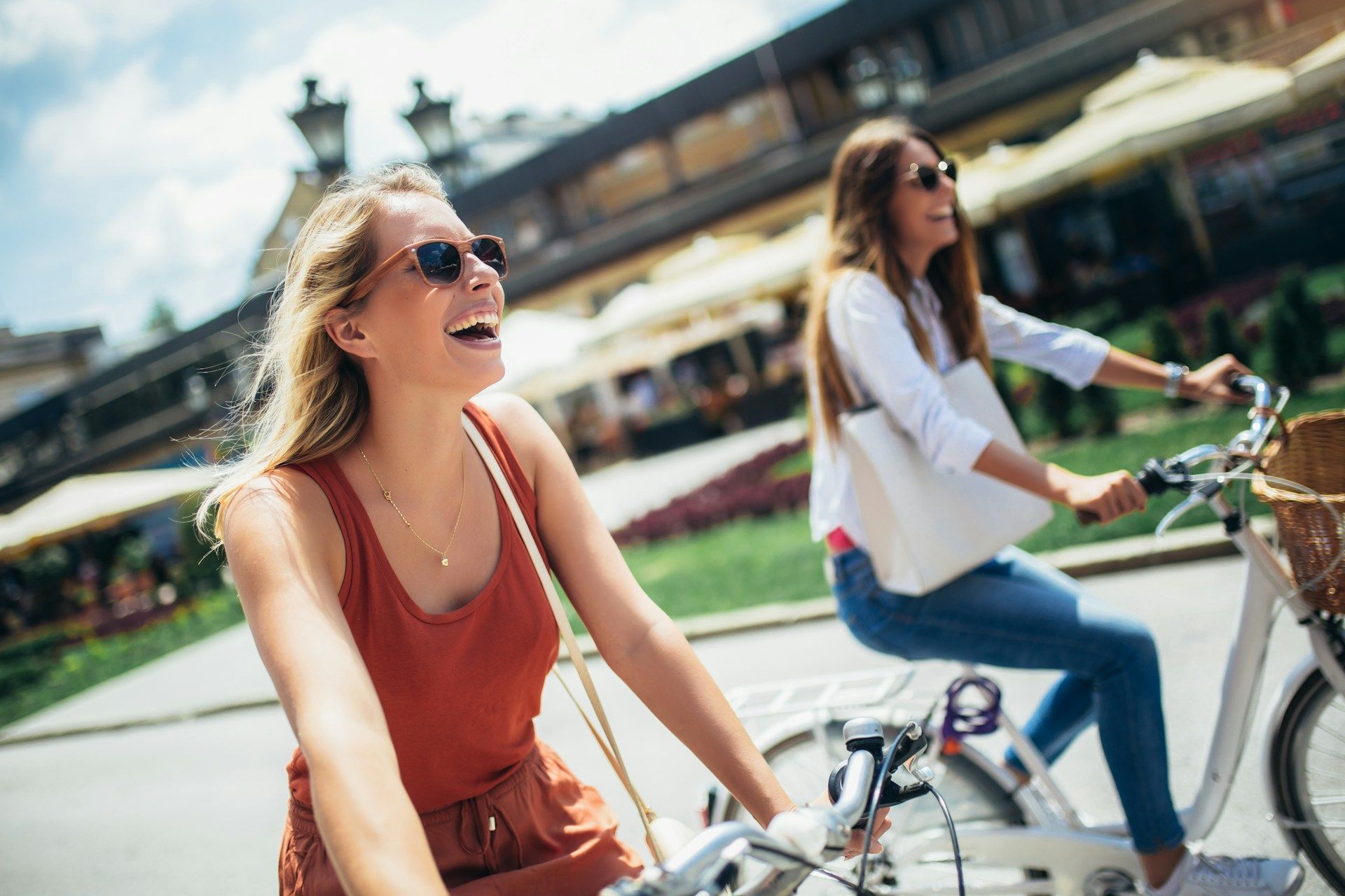 A man in a blue shirt and tie is holding a binder with papers in it.