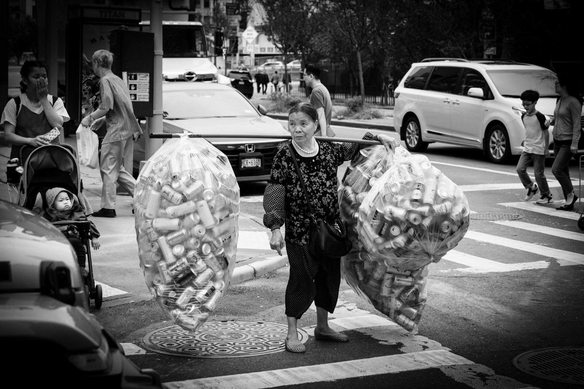 plastic battle can woman work workers new york nyc street urban scene people architecture line blackandwhite bnw bew bw dark