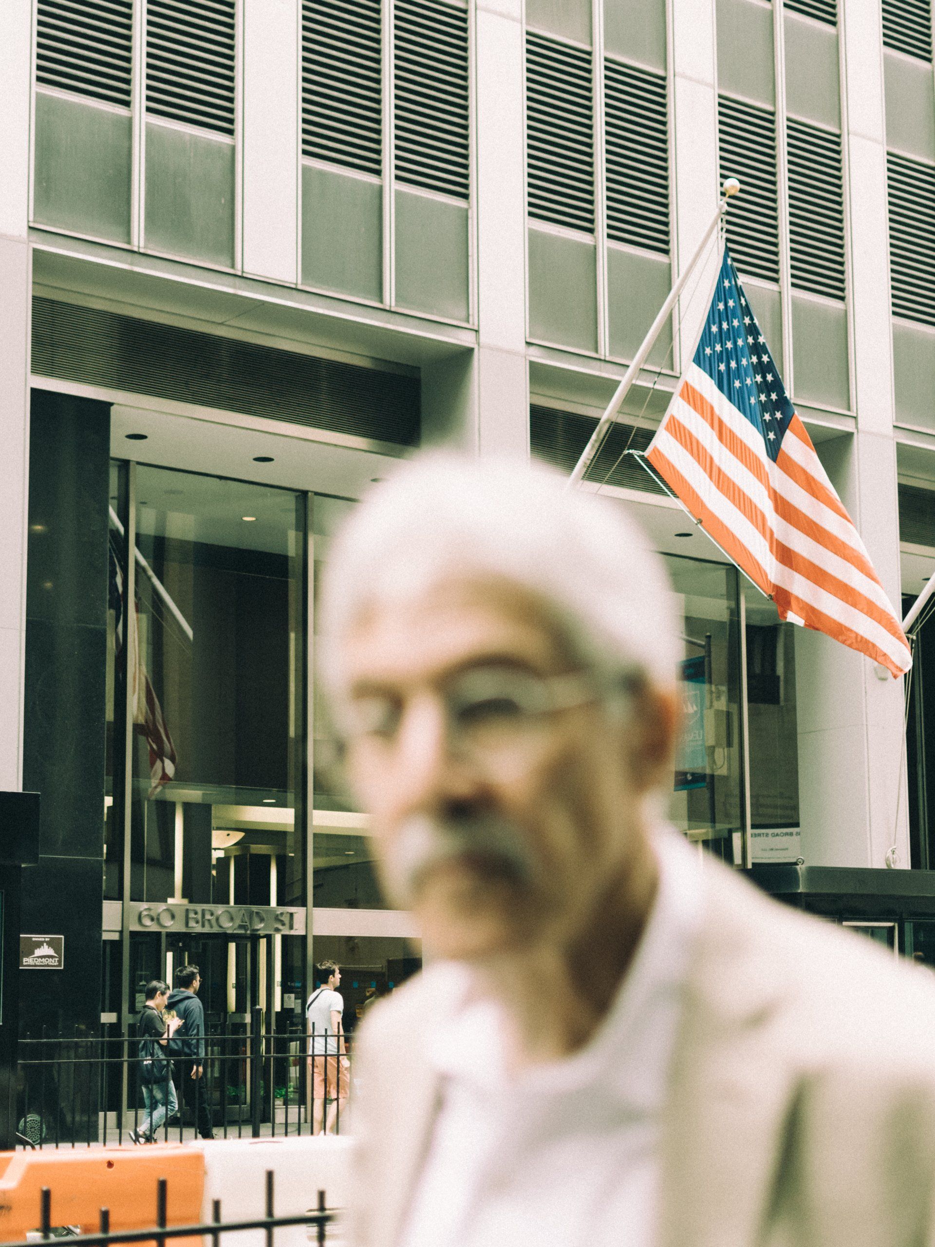 bokeh focus flag american wallstreet wallst new york street urban man scene nyc ny usa united states america