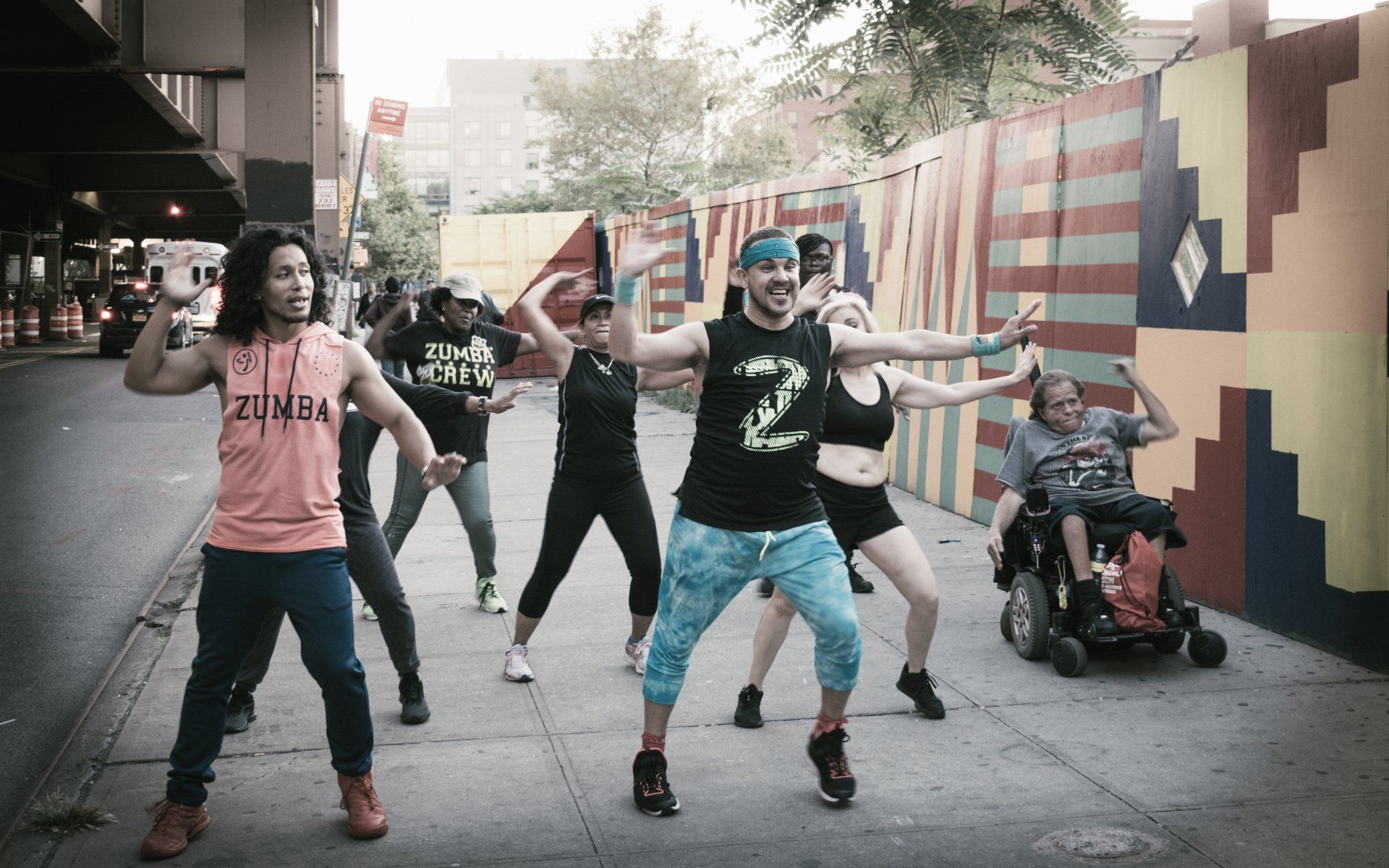 Team dancing in harlem street New York