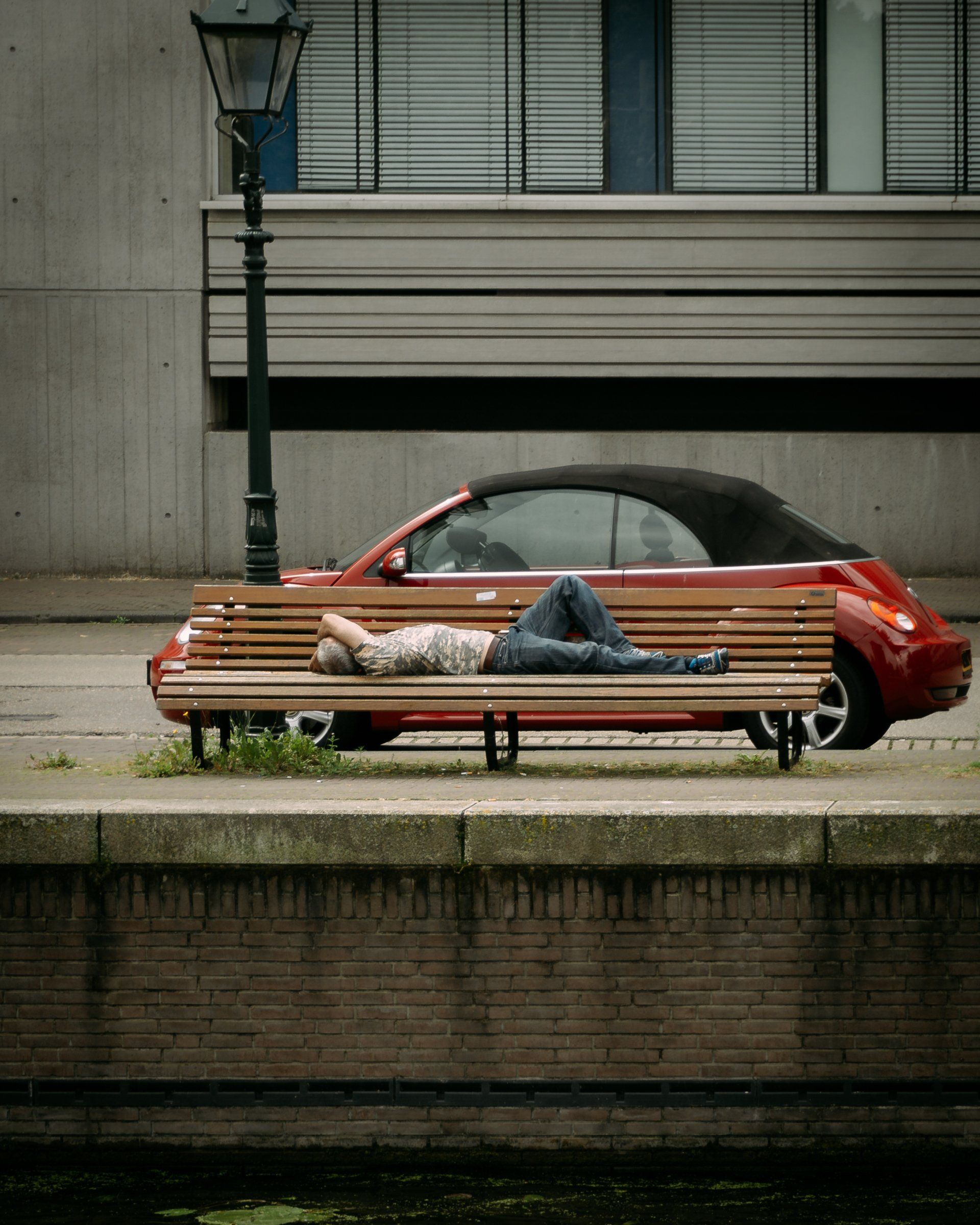 A person sleep in a bench in Den haag the netherlands