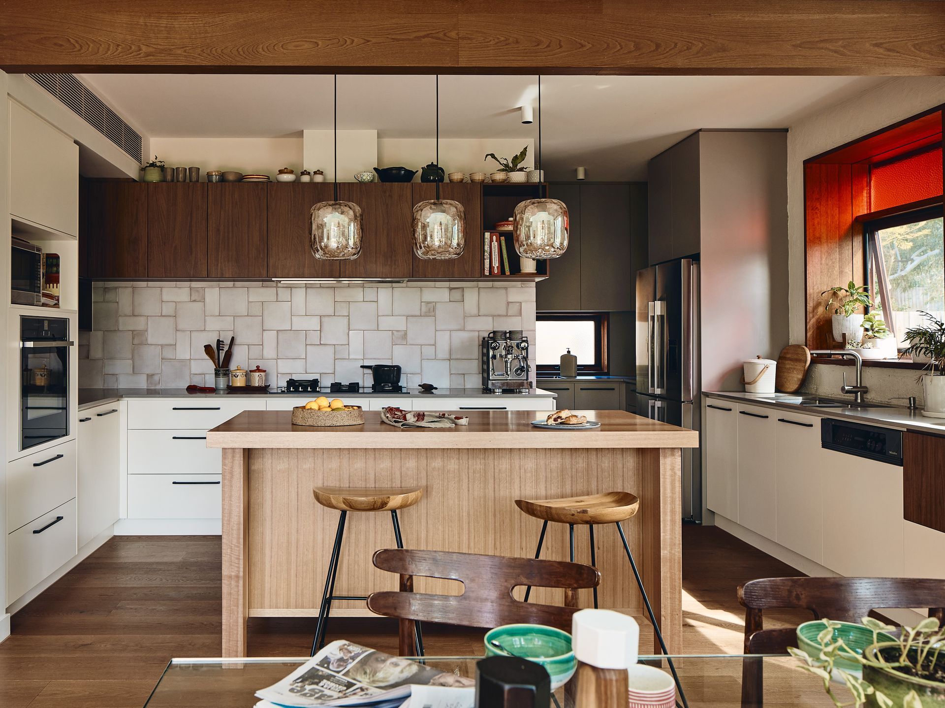 A kitchen with a large island in the middle of it