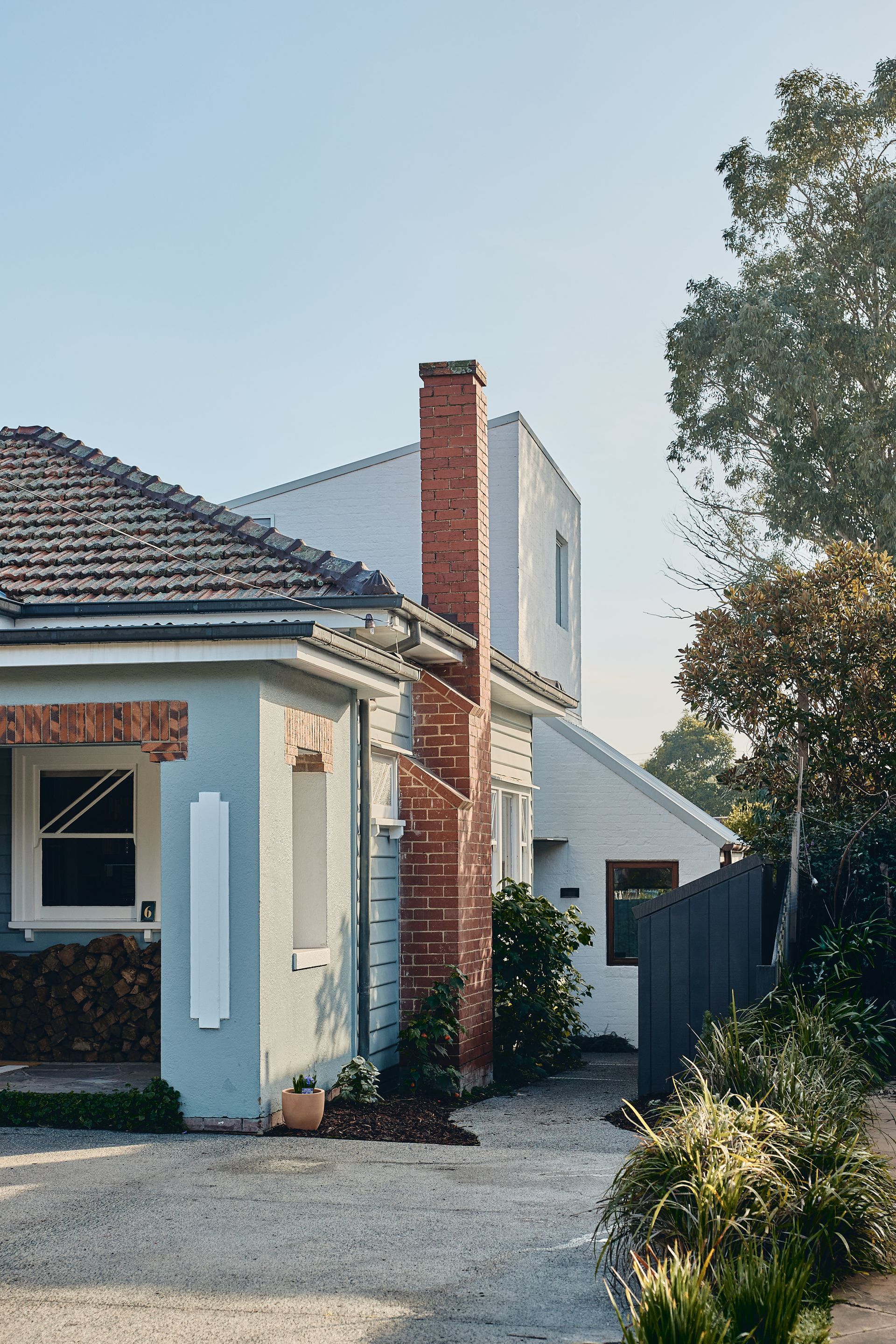 A house with a brick chimney on the side of it