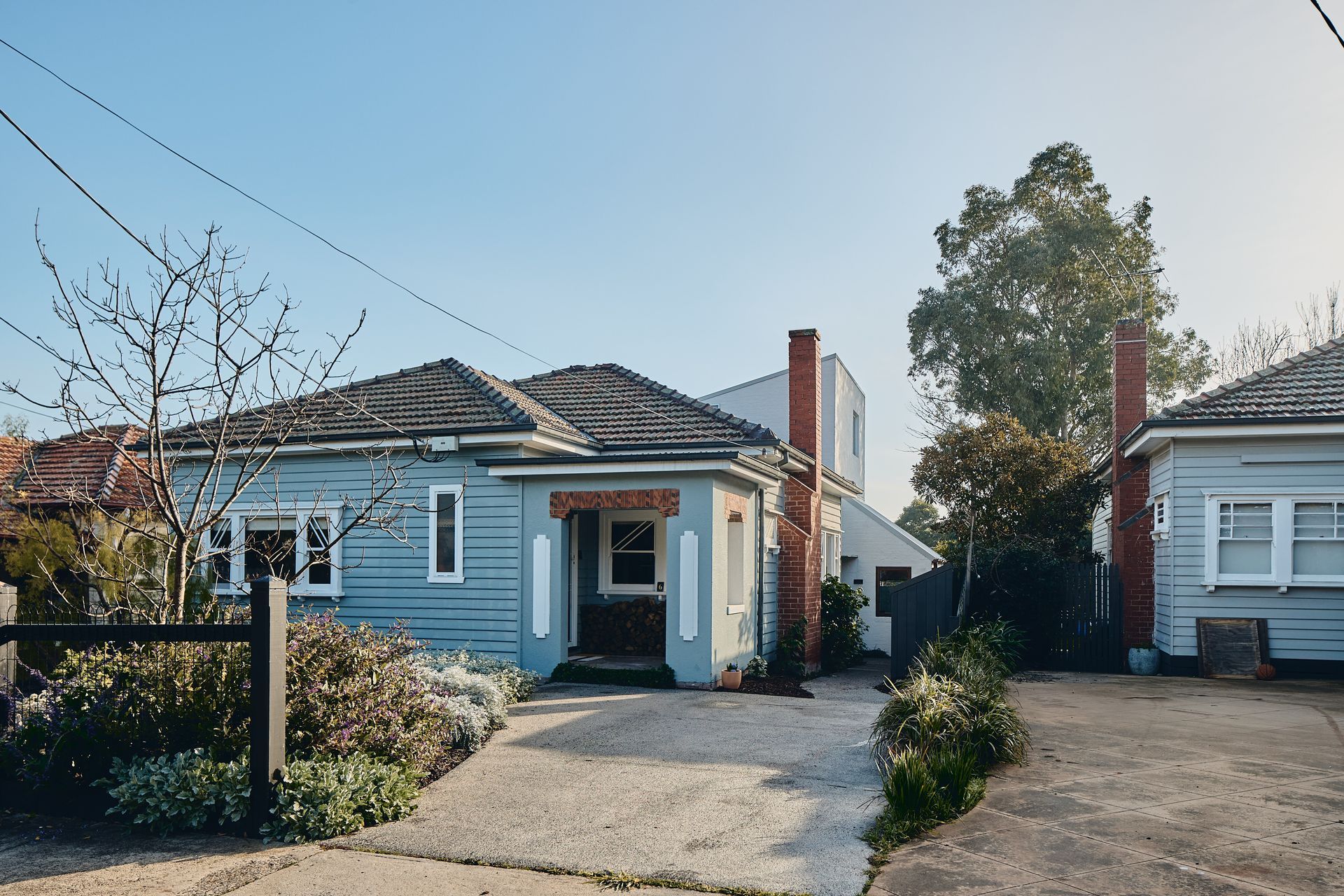 Two houses are next to each other on a sunny day
