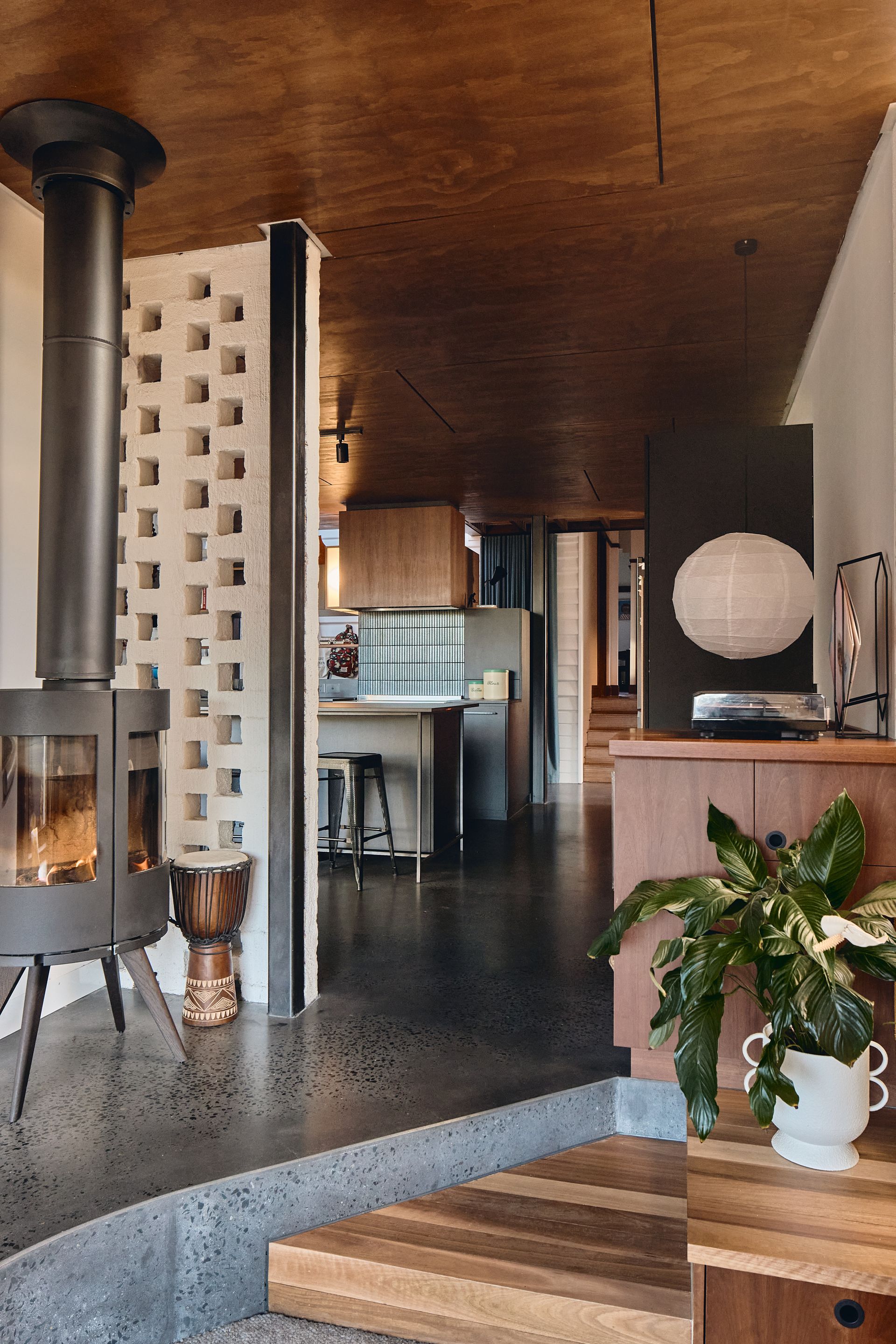 There is a wood stove in the middle of the room.