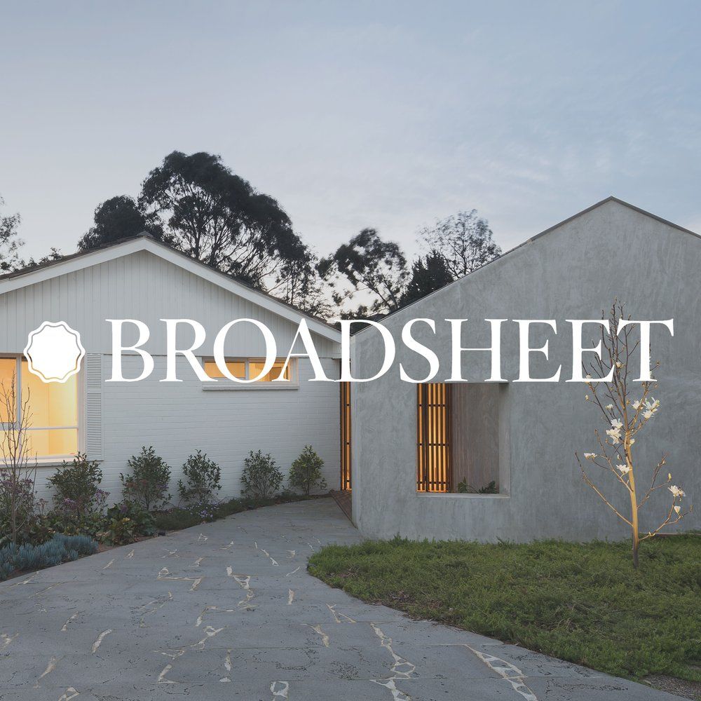 A white house with the word broadsheet on it