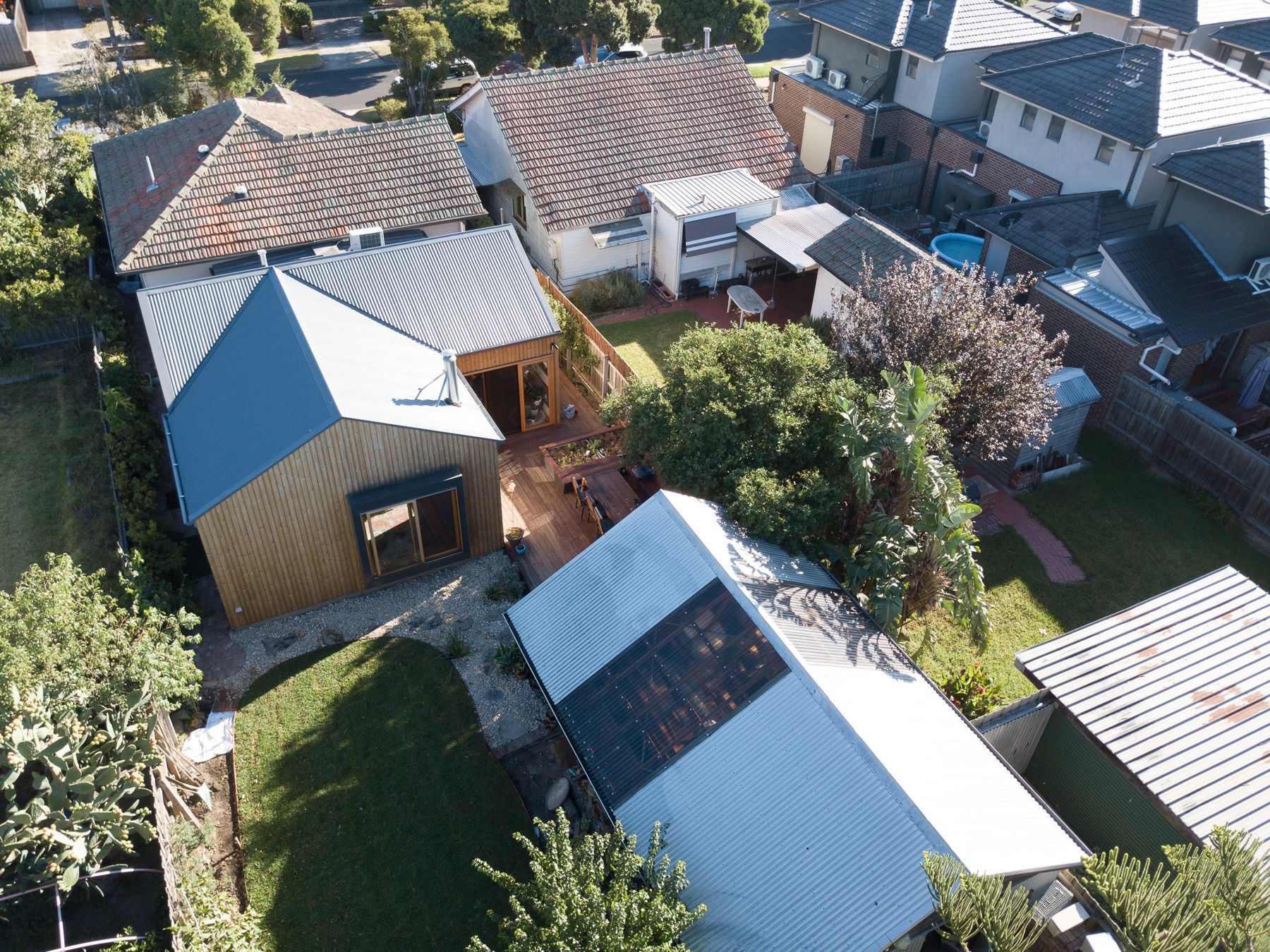 An aerial view of a residential area with houses and trees