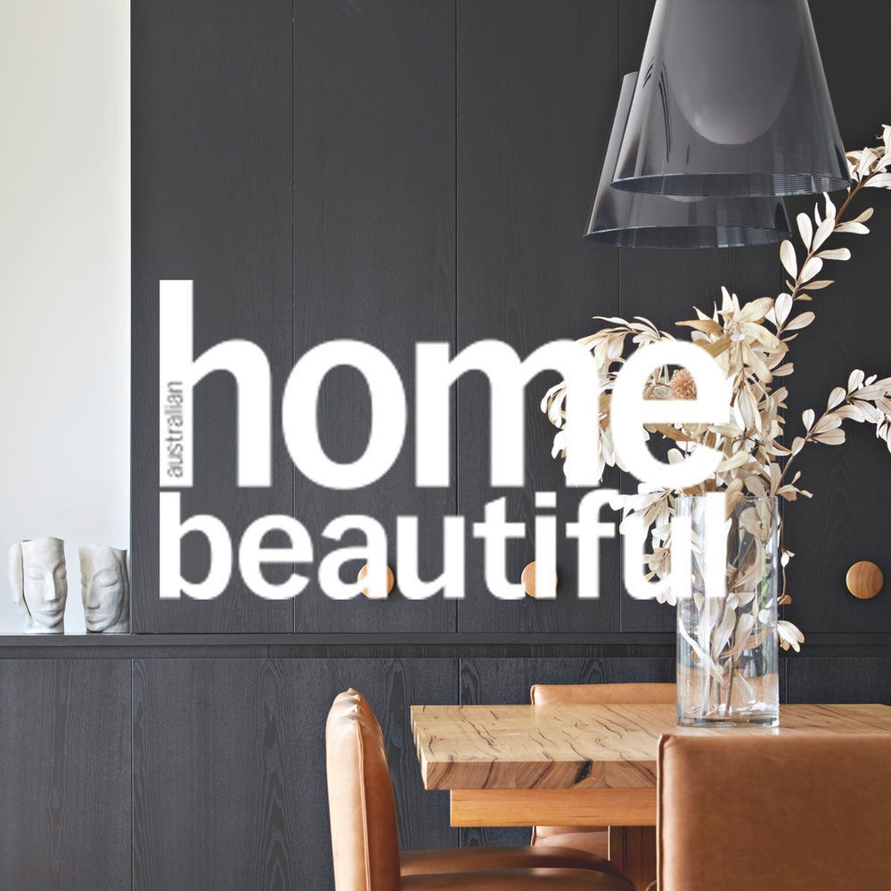 An advertisement for home beautiful shows a dining room with a table and chairs