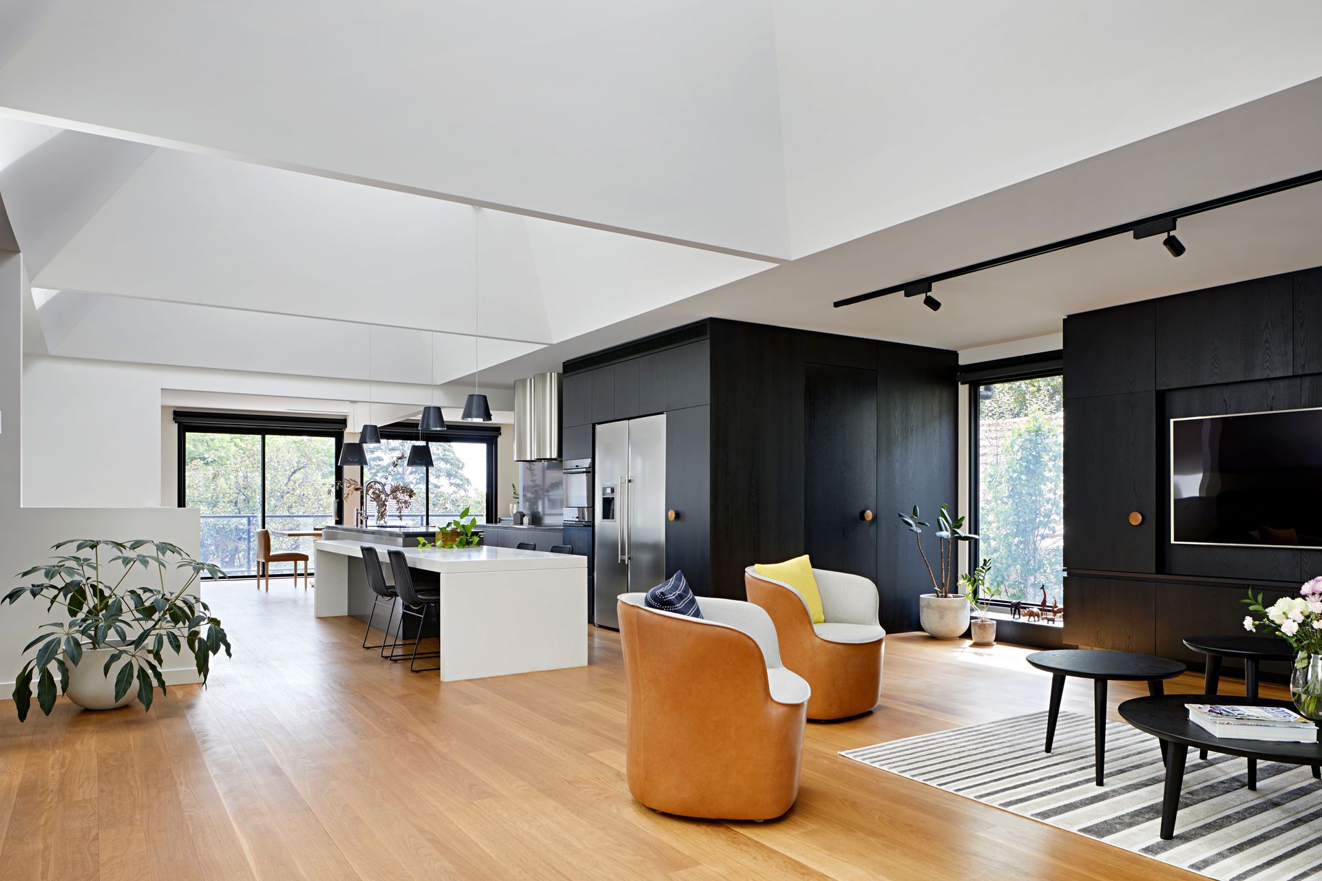 A living room filled with furniture and a television.