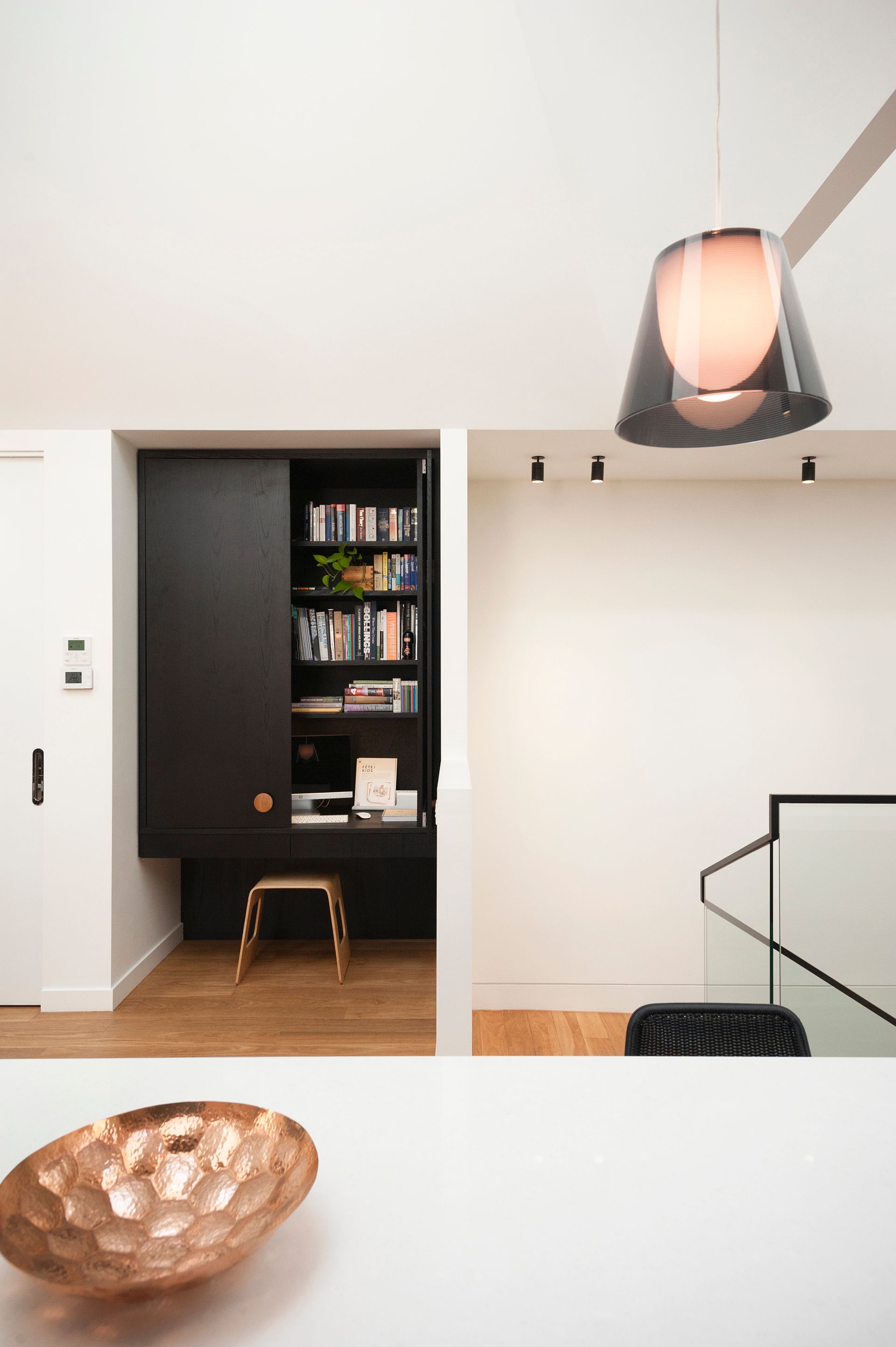 There is a bowl on the table in the middle of the room.