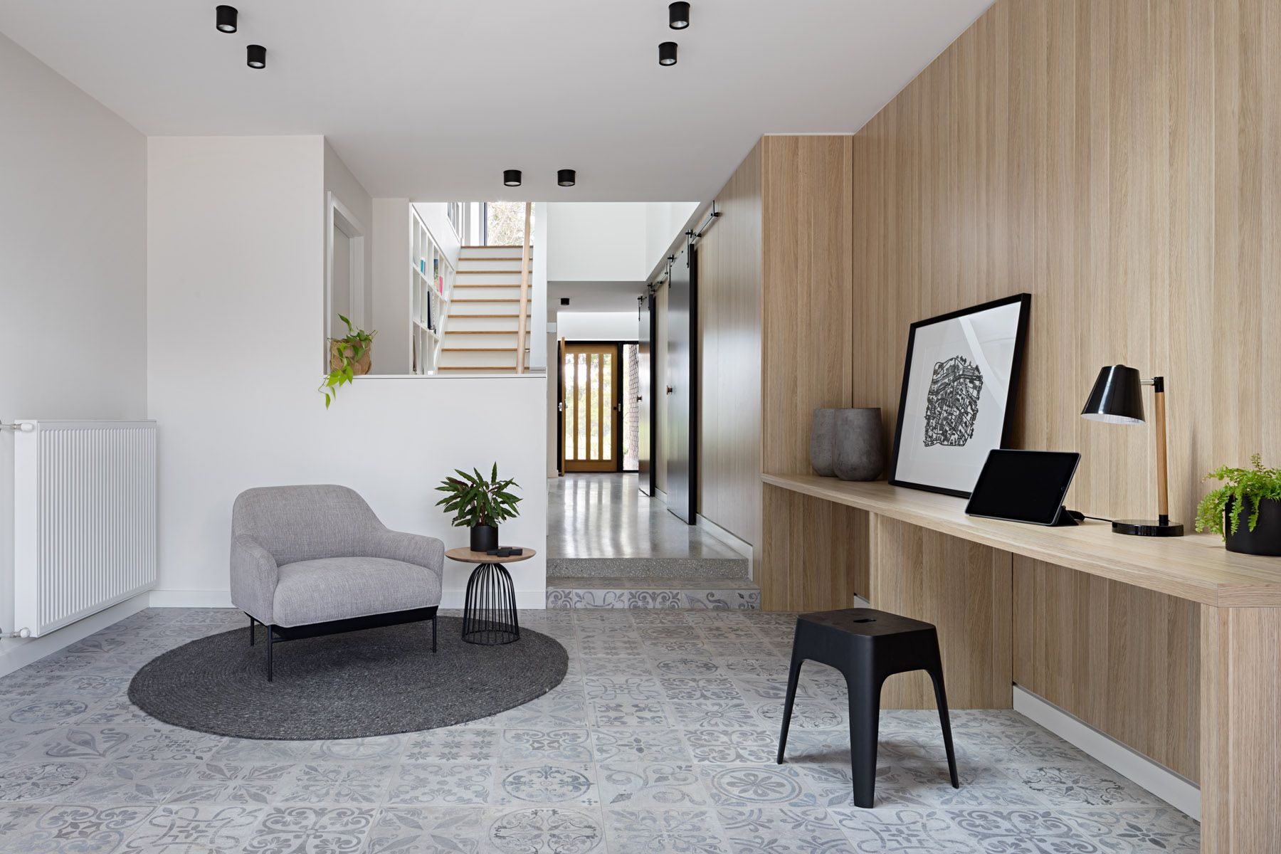 There is a chair and a desk in the room.