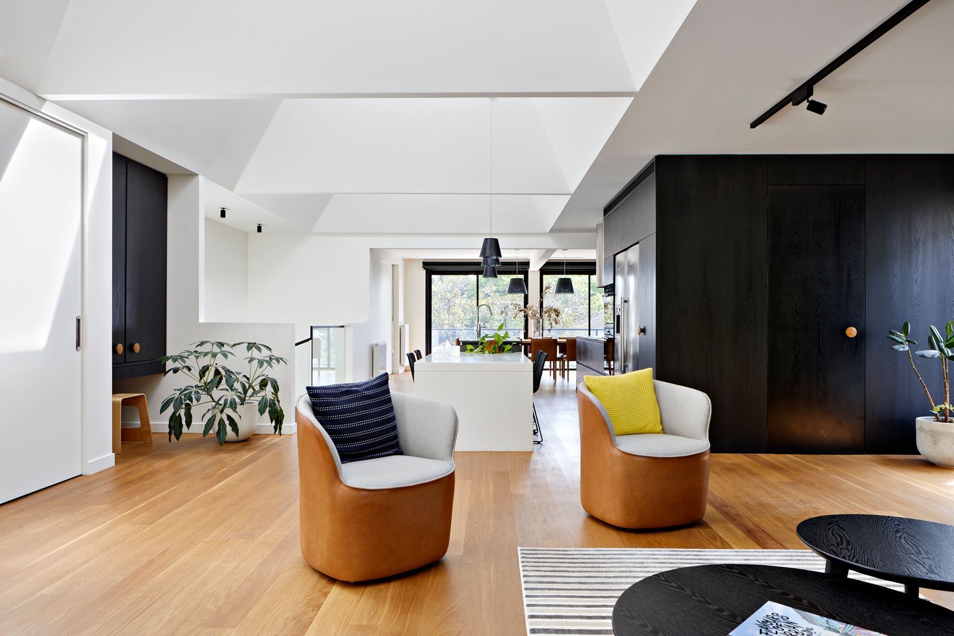 A living room with two chairs and a table.