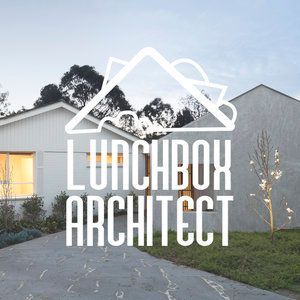 A logo for lunchbox architect with a house in the background