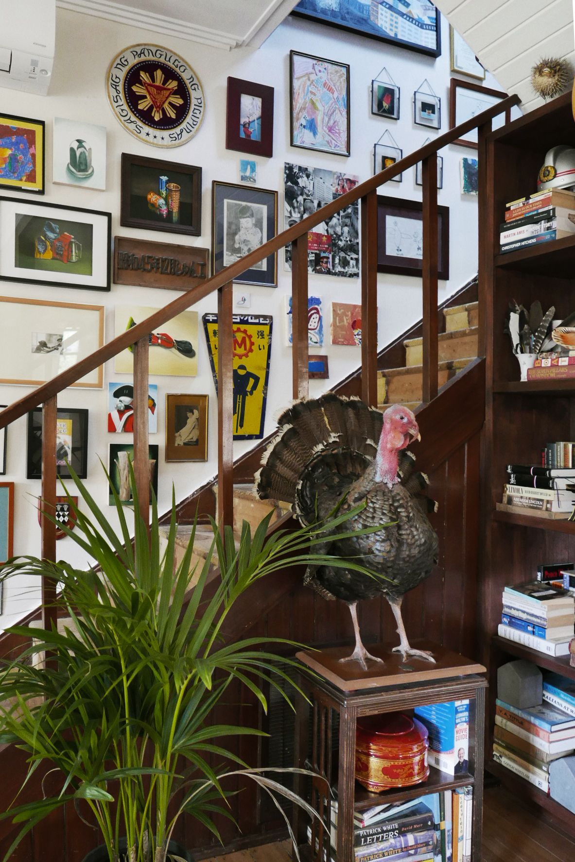 A staircase with a statue of a turkey on top of it